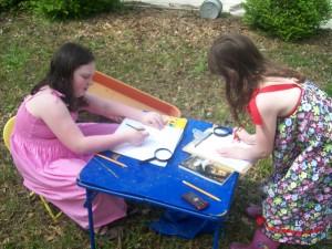 The girls recording their observations for school.