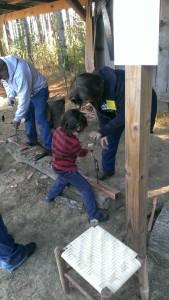 Isaiah drilling a hole like a boss