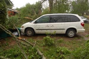Our van escaped without a scratch. In fact I moved the branch on top of the trash. Had the trash can not slid under the branch it would have probably gone through the radiator!